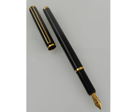 A Dunhill fountain pen, having 18ct gold nib and gold plated details.
