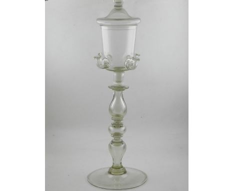 A large Georgian glass lace maker's lamp, the lidded bucket shaped bowl with four nozzles, having baluster turned support, th