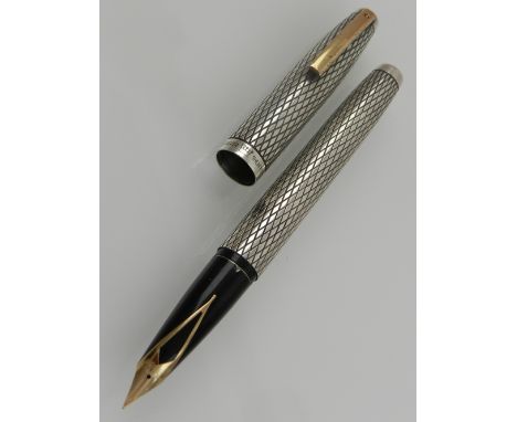 A Sheaffer, USA, Sterling silver fountain pen, having crosshatched design and 23k gold plated nib.