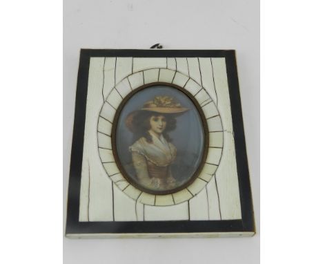 In the 19th century style, an oval miniature half-length seated portrait of a lady, within a parcel ebonised ivory frame, fei