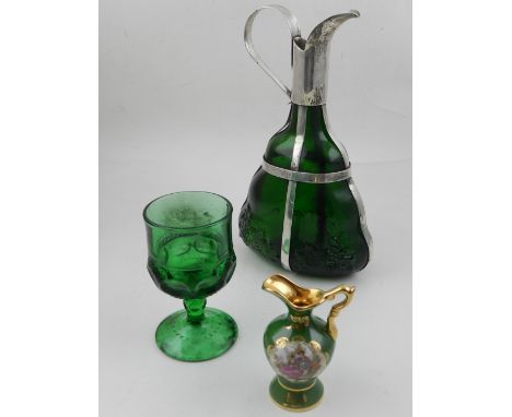 A white metal mounted green glass flask, with moulded grape design to base, together with a green faceted glass and a small c