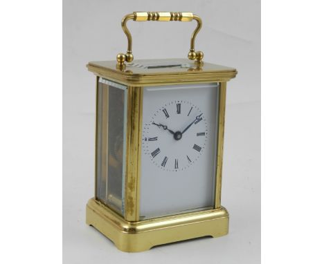A 20th century carriage timepiece, in a cornice case the white enamel dial set our in Roman numerals, H. 12cm.