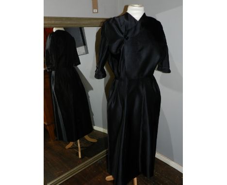 A 1960s Christian Dior black silk wrap around ladies dress. approx. size S/M