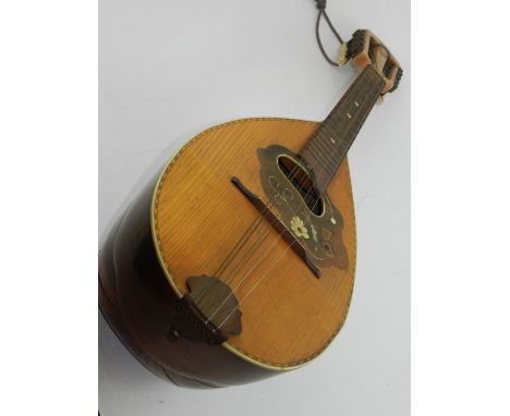 A mandolin, inlaid with mother of pearl flora and fauna. L.60cm