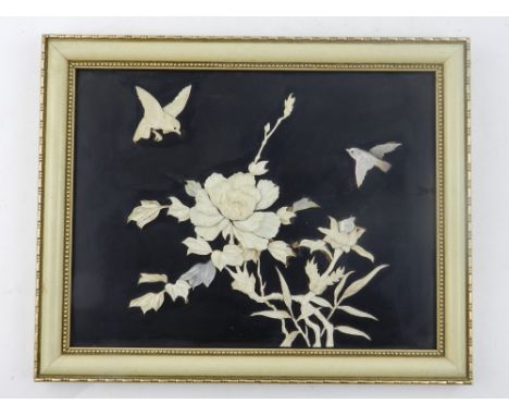 A Japanese Shibayama lacquered panel, inlaid with ivory and mother of pearl depicting songbirds amongst chrysanthemums. 