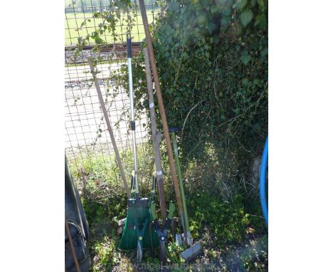A quantity of garden tools including. clippers, hoes, brooms and forks.