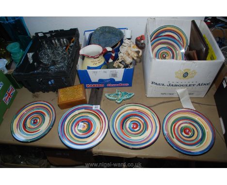 A tray of various drinking glasses, door stop, table lamp, etc.