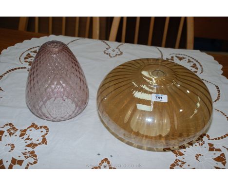 Two glass light shades.