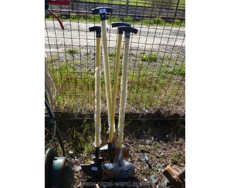 Four garden lawn edging tools.