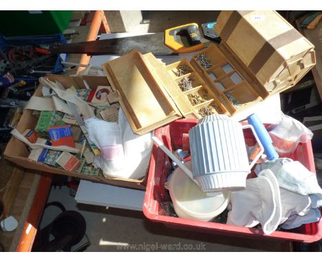 Two wood saws, a tool box, bulb planter, gloves, etc.