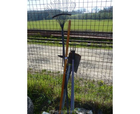 A quantity of garden tools including. spade, fork, rake etc.