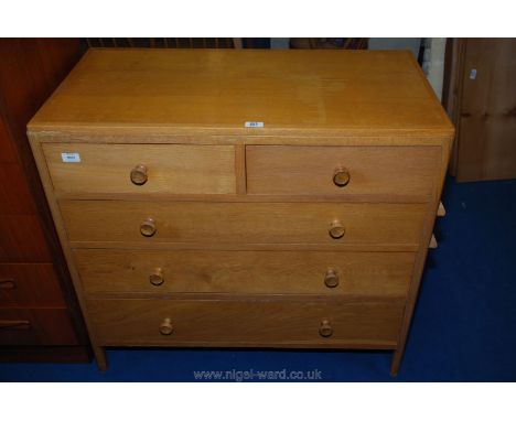 A light oak coloured two over two chest of drawers 36" x 33" x 18".