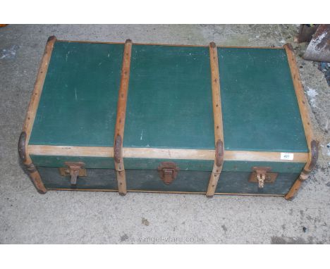 A bentwood bound steamer trunk.