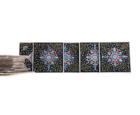 SET OF EIGHTEEN PERSIAN CERAMIC TILES,20th century, enamelled with arabesque foliate scrolls and devices against black ground
