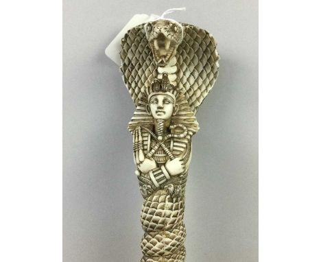 EGYPTIAN STYLE DAGGER,with serpent moulded resin handle and scabbard, 41cm long
