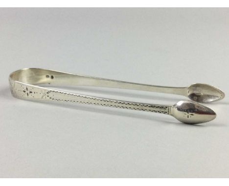PAIR OF LATE GEORGIAN SILVER SUGAR TONGS,along with a silver and mother pearl pickle fork, salt pot, ink well, and assorted p