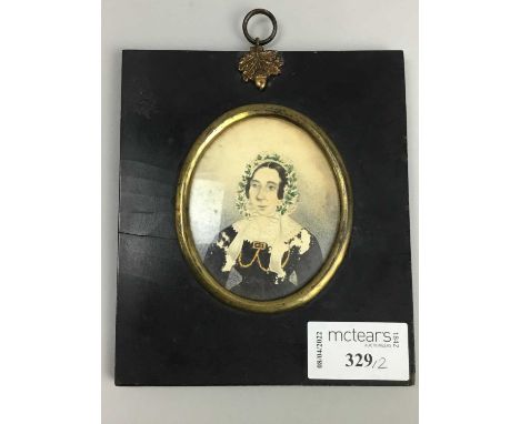 PAIR OF PORTRAIT MINIATURES OF A LADY,watercolour on paper, in profile and face-on
