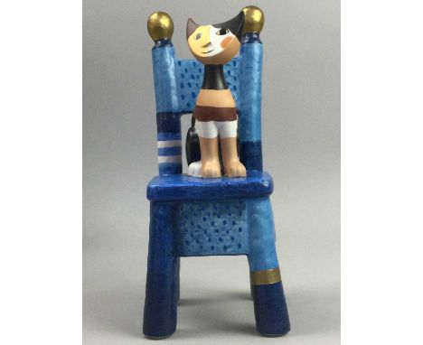 GOEBEL MUSICAL FIGURE OF A CAT ON A STOOL,by Rosina Wachtmeister, 24.5cm high