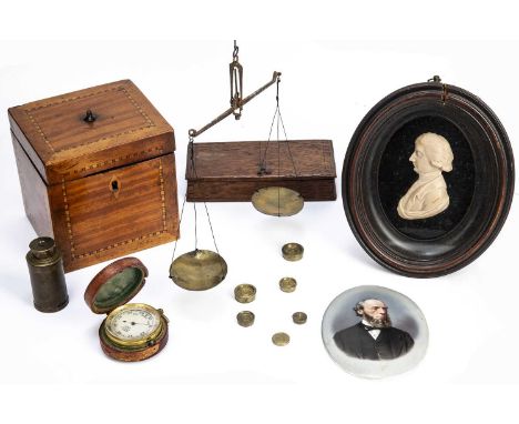 A late 19th century brass pocket barometer by Wood of Liverpool, 4.7cm diameter, cased, together with a pocket telescope an 1