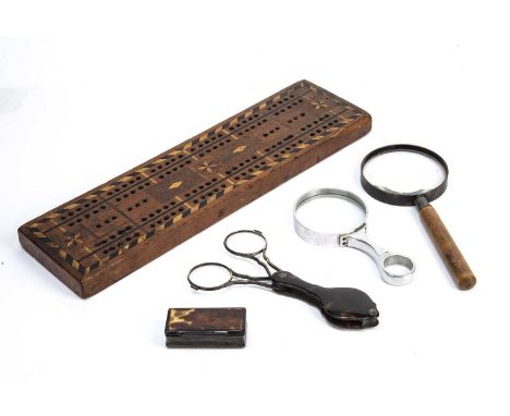 An antique tortoiseshell and white metal lorgnettes, 16cm in length folded out, a Dollond London magnifying glass, 13cm in le