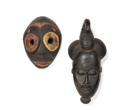 African tribal Baule Mblo portrait mask, Ivory Coast 20cm x 41cm together with a Guere mask with applied colours, ivory coast