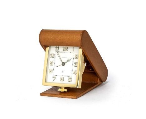 An early to mid 20th century Jaeger LeCoultre desk timepiece the dial with arabic numerals, numbered 126071, in a folding tan