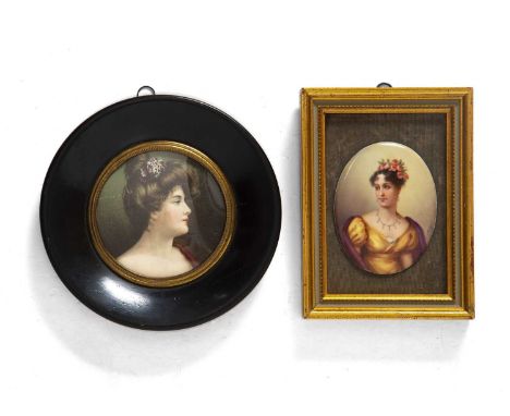 A 19th century oval miniature portrait on porcelain of a young girl with pink roses in her hair and a pearl necklace, indisti