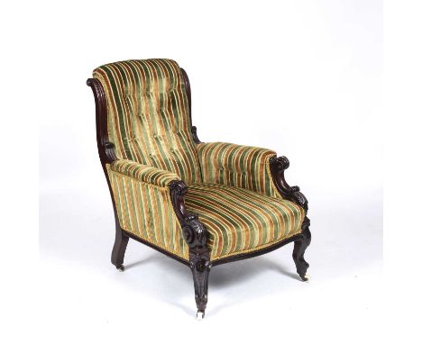 An early Victorian upholstered library armchair with acanthus scrolling arms, cabriole legs terminating in ceramic casters, 6