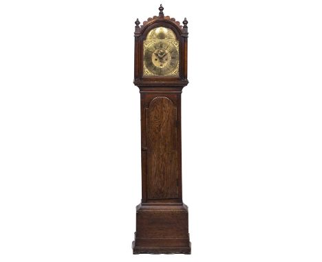 A 19th century oak eight day longcase clock, the brass break arch dial with Roman chapter ring, Arabic five minutes and matte