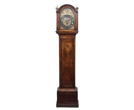 An 18th century eight day walnut longcase clock, the 12" break arch brass dial with silvered Roman chapter ring and Arabic fi