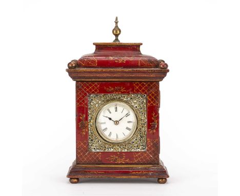 A late 19th century desk top timepiece with convex white enamel roman dial enclosed by a hinged door with pierced brass mount