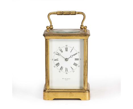 A French gilt brass carriage timepiece, the white enamel Roman dial with Arabic five minutes, retailed by W.W. Logan, Paris a