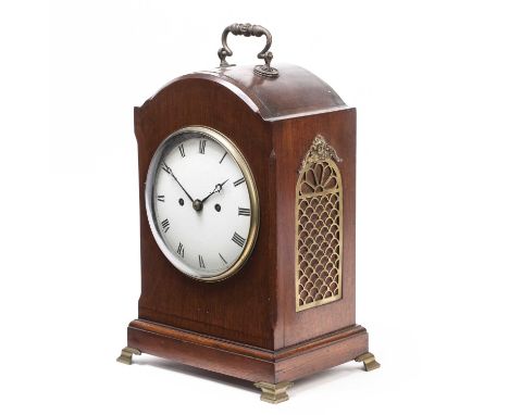 An Edwardian mahogany bracket or table clock with convex white Roman dial, the twin chain fusee movement with shouldered plat