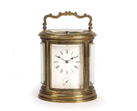 A 19th century French oval brass carriage clock, the white enamel Roman dial with subsidiary alarm dial, platform lever escap