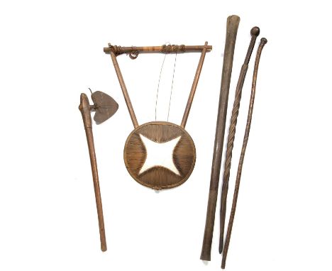 An antique tribal hardwood staff carved with a spiralling snake decoration, 100cm in length together with an antique iron axe