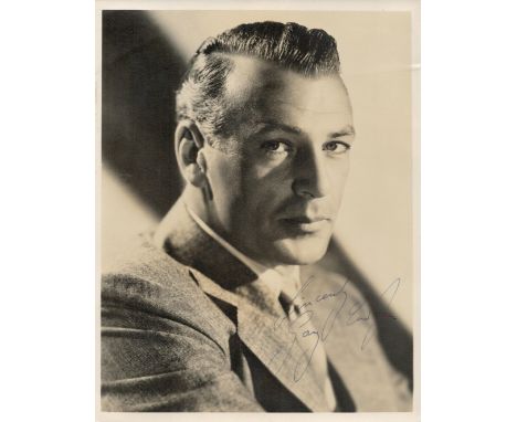 Gary Cooper signed 9x7 vintage sepia photo with original Samuel Goldwyn Productions mailing envelope dated 1938.  Good condit