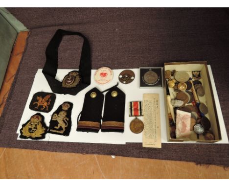 A collection of Military Buttons, Epaulettes, Cloth Badges and a George V Special Constable Medal to William Carr along with 