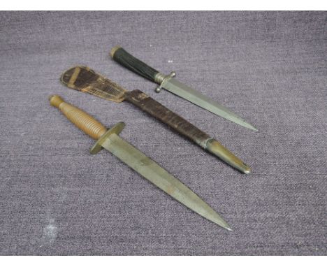 An English Fairburn-Sykes 3rd pattern 1942 onwards with turned ribbed grip, straight double edged blade, no scabbard, blade l