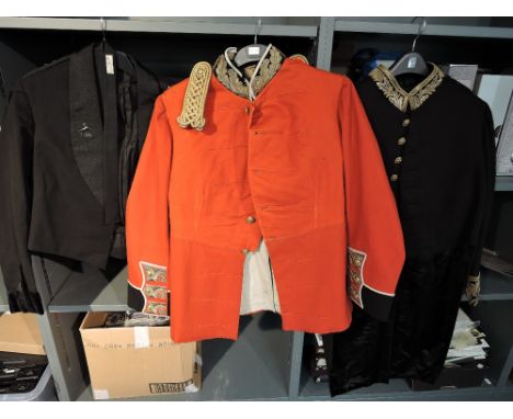 A black Mess Jacket with The Kings Lapel Badge, Pips, Crown and T on shoulder with Hawkes &amp; Co Piccadilly Label written o