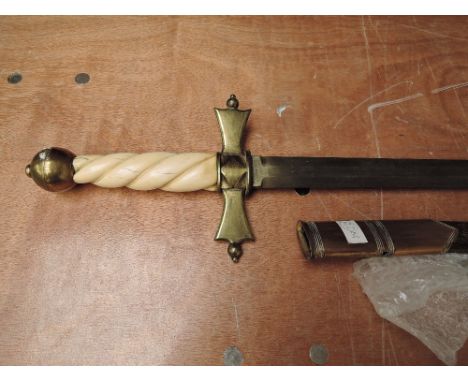 A reproduction Medievel Sword with brass crossguard with bone coloured plastic handle with brass pommel, leather and metal sc