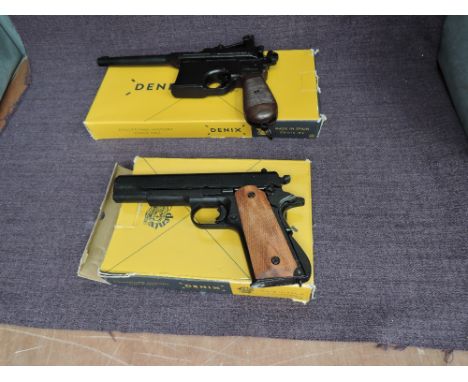 A Denix Replica 1896 German Mausser in box and a Denix Replica M1911A US Army Automatic Revolver in box