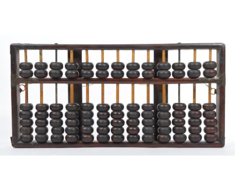 An early 20th century circa 1920s Chinese wooden abacus calculator having reed bars and metal strap hinged to sides. Measures