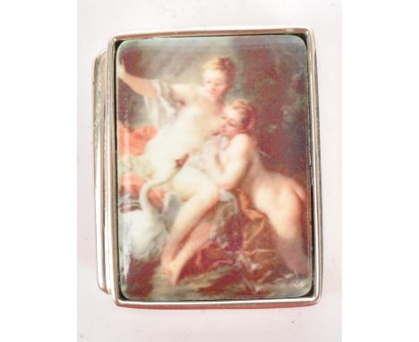 A silver 925 and enamel pill box. The pill box with enamel set plaque lid depicting an erotic scene. Stamped Sterling.&nbsp; 