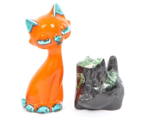 Two retro ceramic pottery cat figurines. One in a an Orange &amp; mint blue colourway by Trentham, marked 372. The other in a