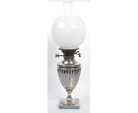 A Silver plated Duplex oil lamp by Miller &amp; Sons of Piccadilly, London complete with original chimney and white glass sha