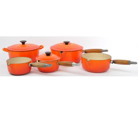 Le Creuset - A collection of 20th century French cast iron Le Creuset cooking pots and pan in the Volcanic Orange pattern. Co