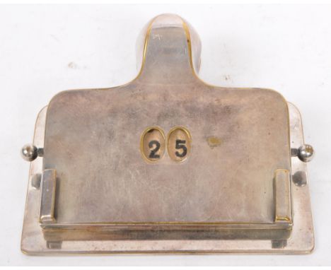 A vintage 20th century chrome metal perpetual calendar in the form of a paper / document clip. Measures approx. 10.5cm wide