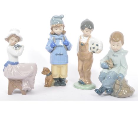 Nao for Lladro - A collection of vintage 20th century NAO Spanish porcelain figurines to include Boy with Rabbit Resting 1037