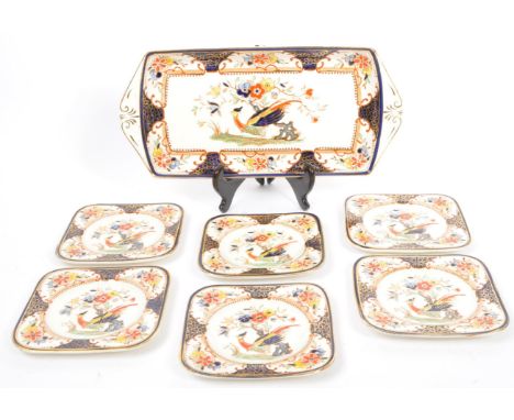 An early 20th century hand painted ceramic&nbsp;''Woods Burslem'&nbsp;pattern sandwich serving dish with six matching side pl
