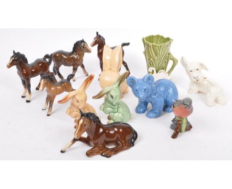 A collection of twelve 20th century English Beswick &amp; Sylvac fine bone china &amp; ceramic animal figurines. The lot to i